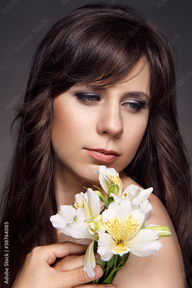 Beautiful woman holding a flower