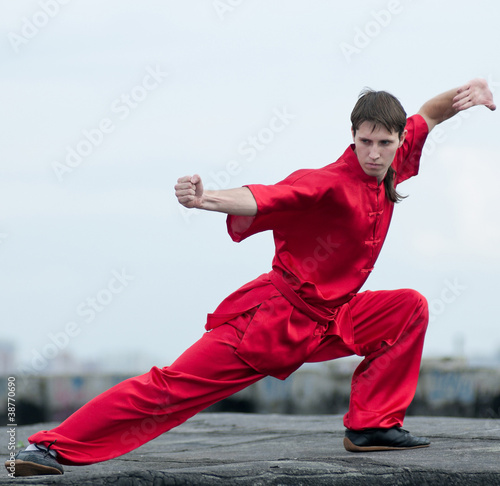 Wushoo man in red practice martial art photo