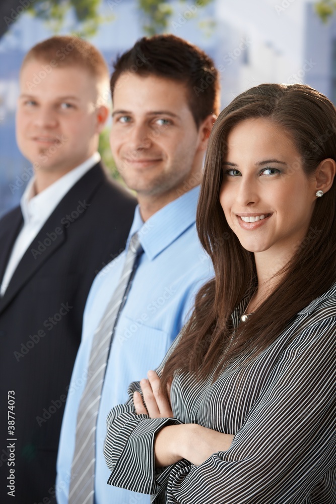 Smiling businesspeople standing outdoors Smiling businesspeople standing outdoors