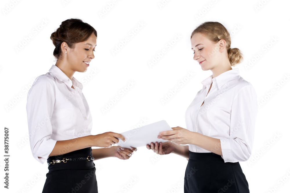 Two beautiful business women having a happy discussion isolated Two beautiful business women having a happy discussion isolated