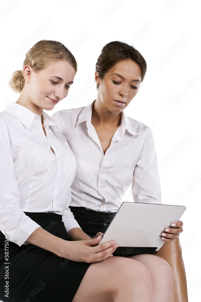 Portrait of two young businesswomen in the studio Portrait of two young businesswomen in the studio