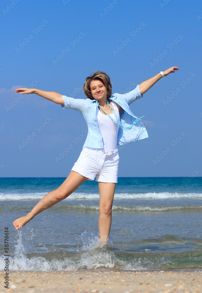 portrait of beautiful young woman on the beach portrait of beautiful young woman on the beach