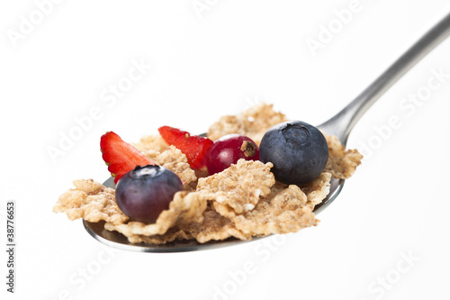 cereals bowl with red fruits isolated on white