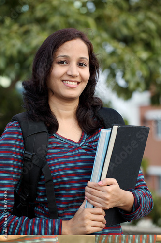Smiling Young indian student at campus