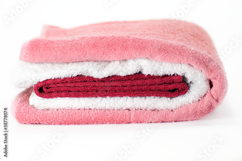 White, red and pink Terry towels isolated on white background