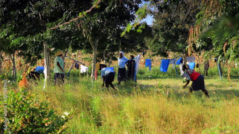Students and workers taking a break in a Kenyan town. Students and workers taking a break in a Kenyan town.