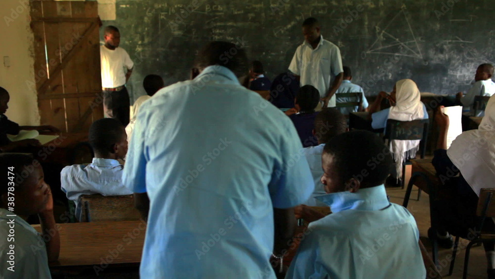 Students taking a test in a classroom in Africa. Students taking a test in a classroom in Africa.