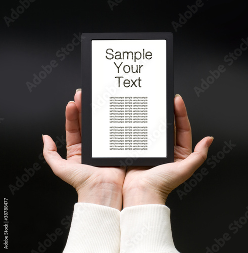 Female hands with electronic book