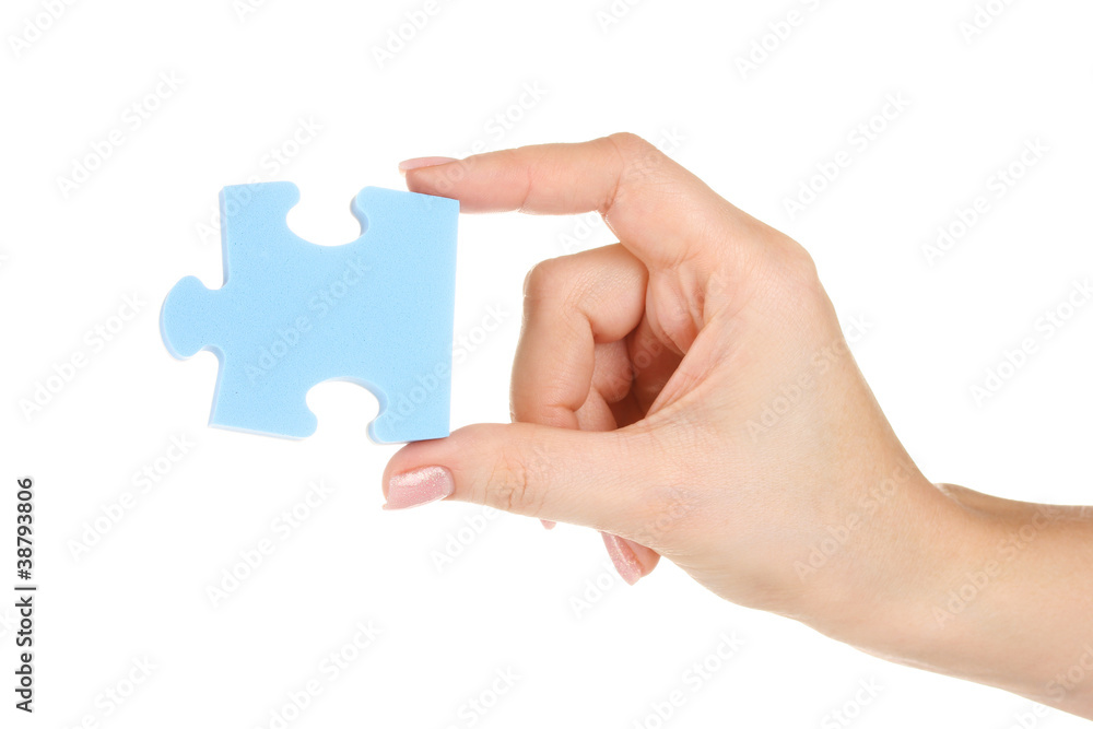 Blue puzzle with a hand isolated on white Blue puzzle with a hand isolated on white