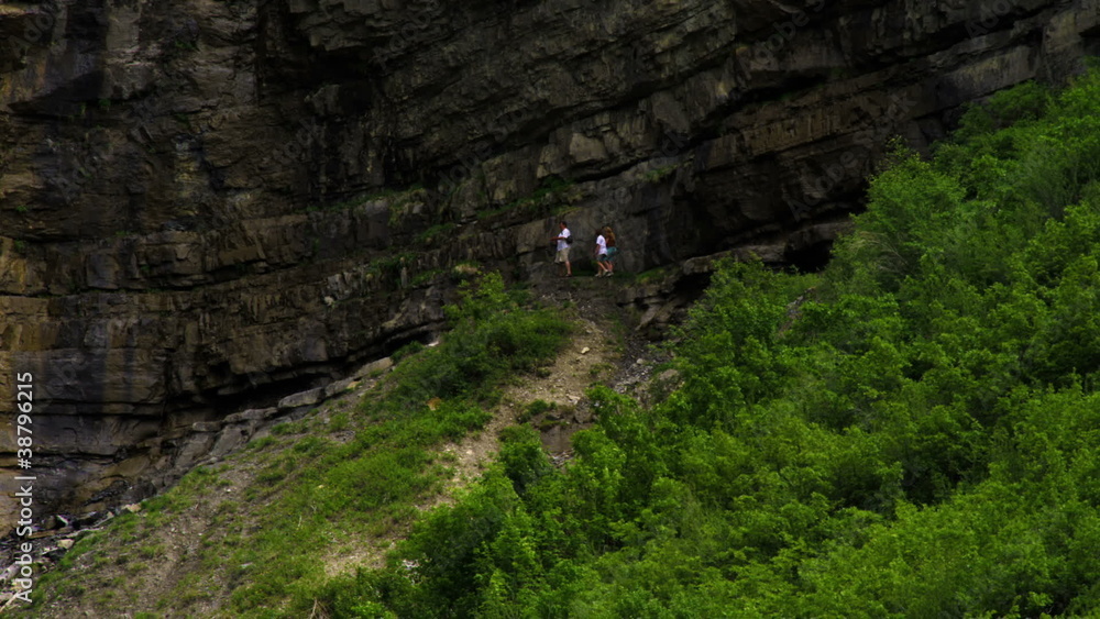 People walking at the base of Bridal Veil Falls in Provo, Utah. People walking at the base of Bridal Veil Falls in Provo, Utah.