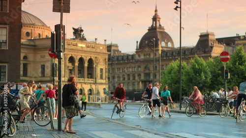 Bicycles and people on a street in Copenhagen, Denmark.