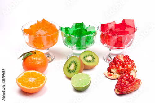 three-colored jelly with fruirs in a row photo