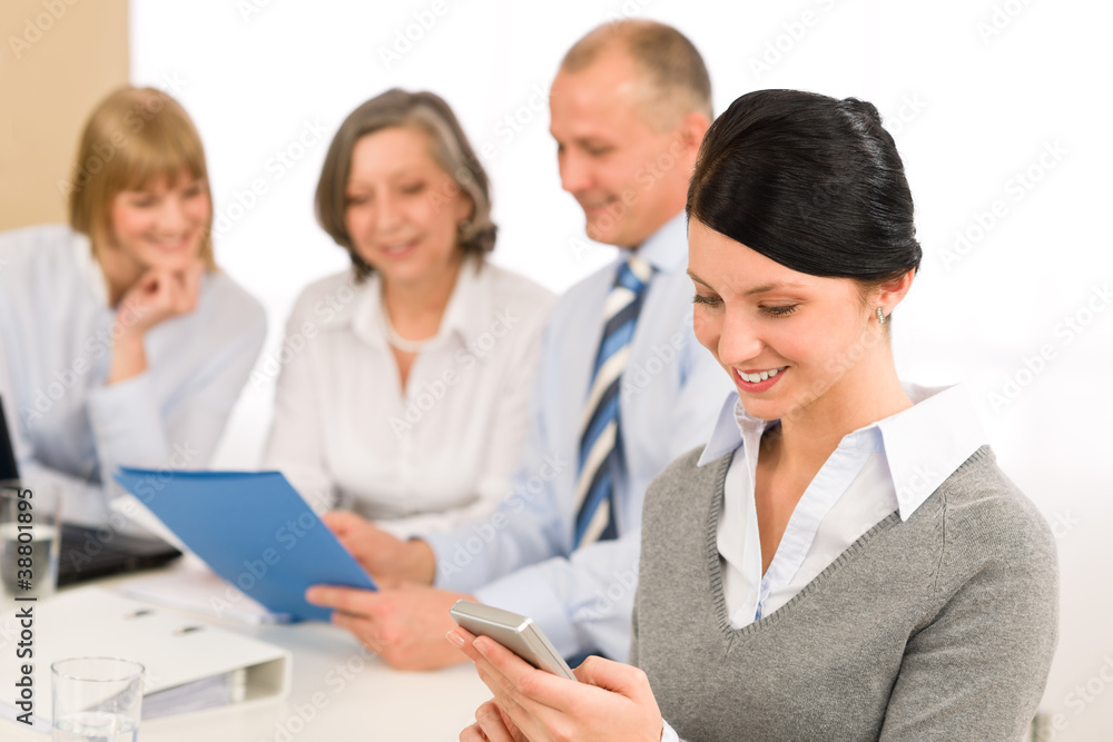 Young executive woman use phone during meeting Young executive woman use phone during meeting