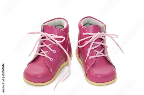 pink baby shoes on a white background