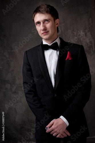 Young man wearing tuxedo.