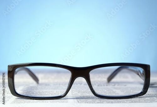 glasses and a newspaper