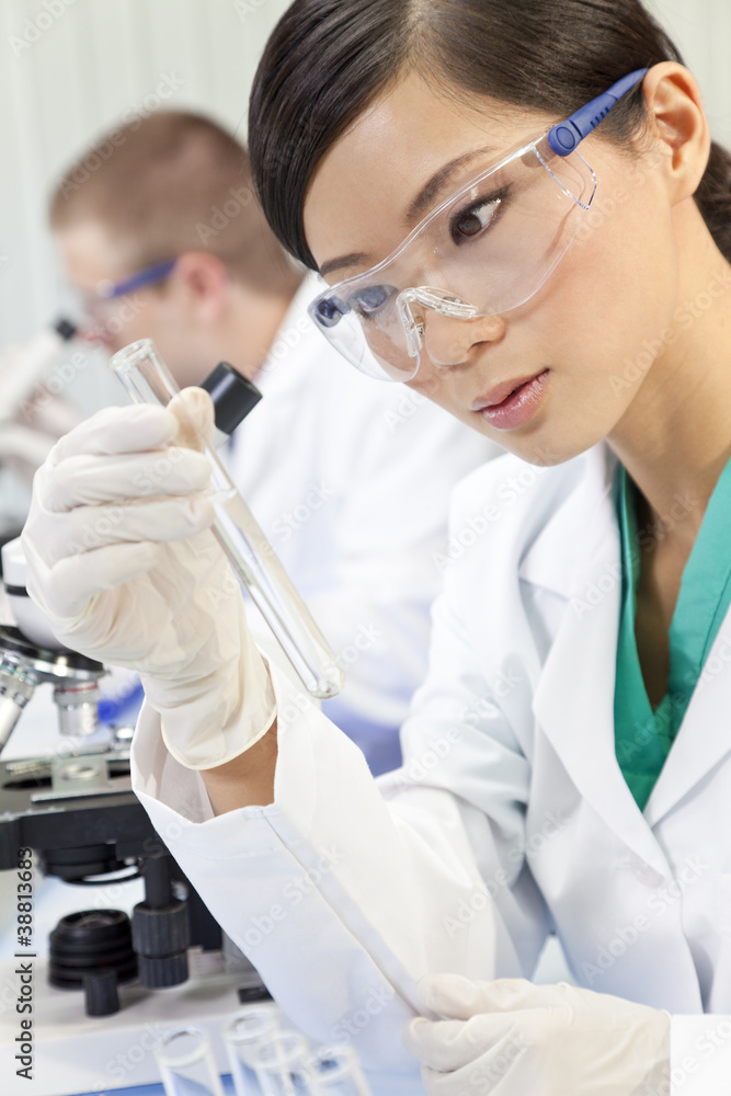 Chinese Female Woman Scientist With Test Tube In Laboratory Chinese Female Woman Scientist With Test Tube In Laboratory
