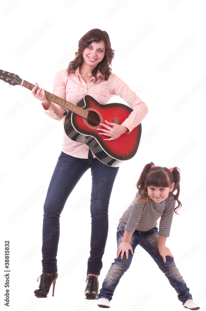 young beautiful mother and her little daughter with guitar