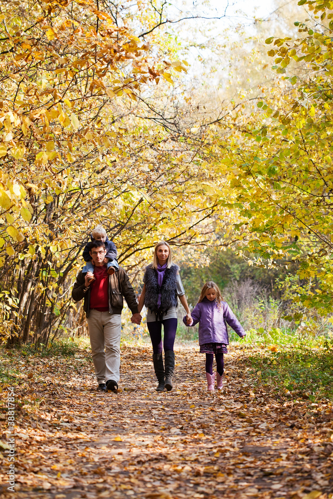 Family Enjoying Walk In Park Family Enjoying Walk In Park