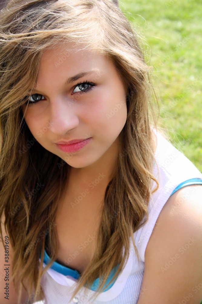 a beautiful teenage girl sat in the garden a beautiful teenage girl sat in the garden