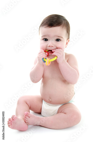 Fototapeta Baby chewing on teething ring