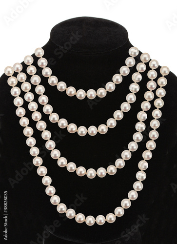 Pearl necklace on black mannequin isolated on white background