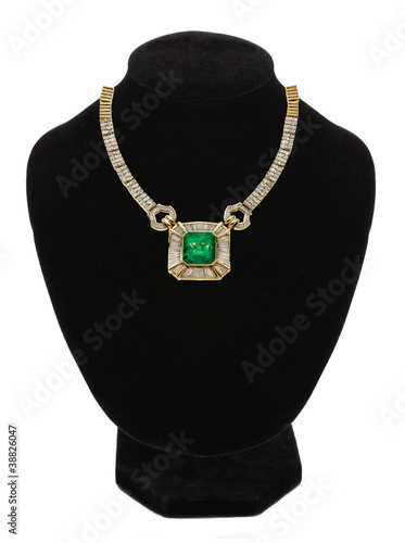 beautiful gold jewellery necklace with green stone on black mann