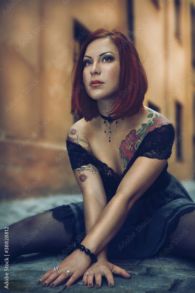 Naklejka premium young female with colourful tattoos.