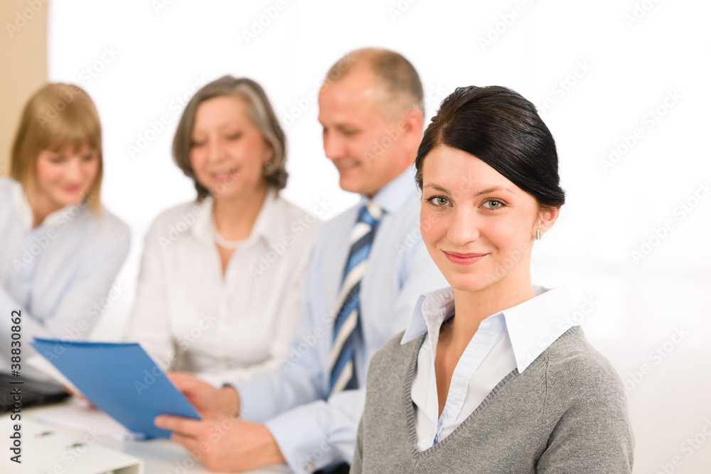 Young executive woman looking camera during meeting Young executive woman looking camera during meeting