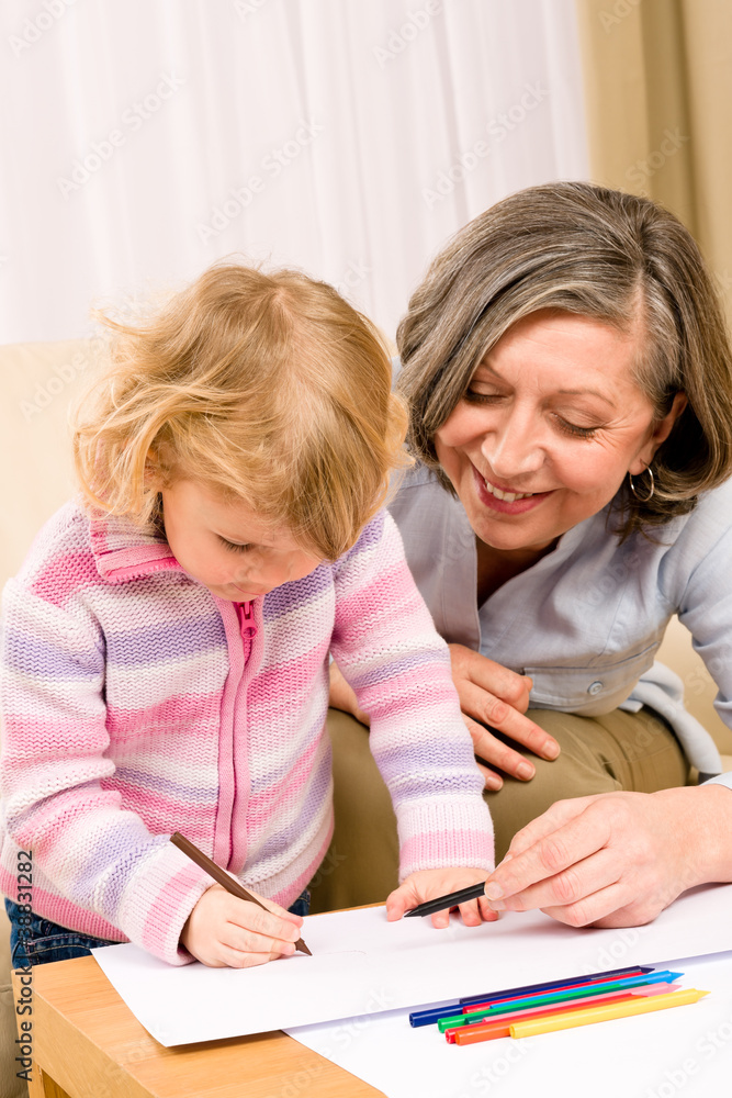 Grandmother and granddaughter drawing at home Grandmother and granddaughter drawing at home