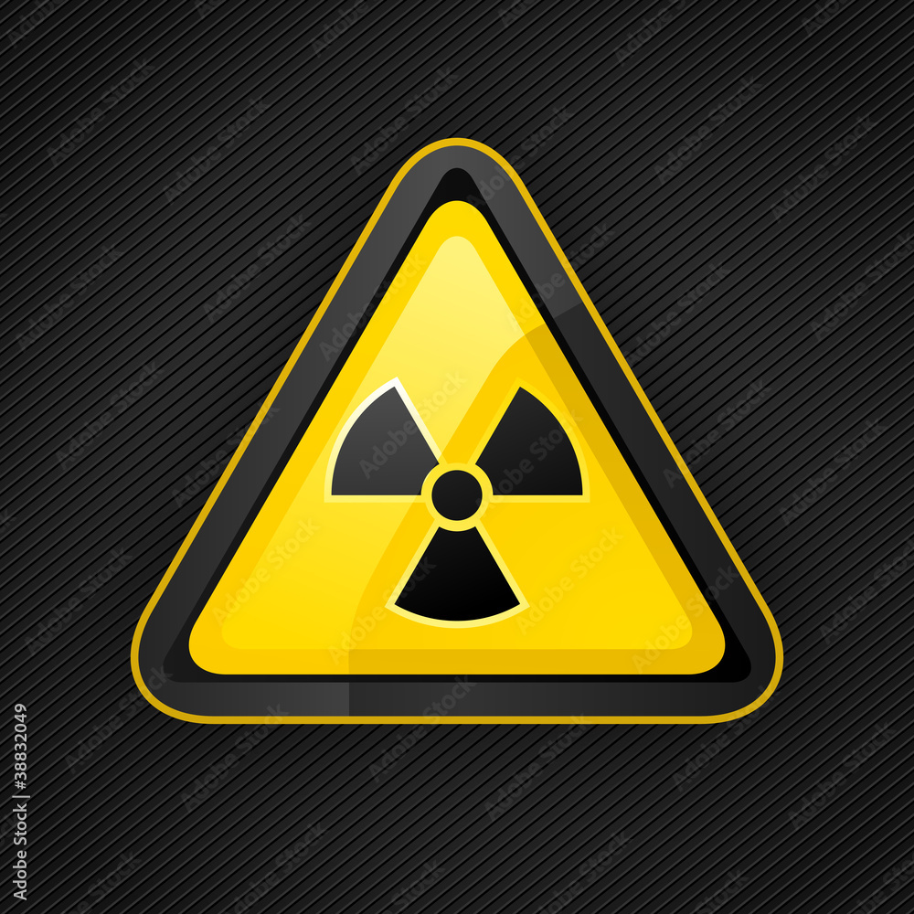 Hazard warning triangle radioactive sign on a metal surface Hazard warning triangle radioactive sign on a metal surface