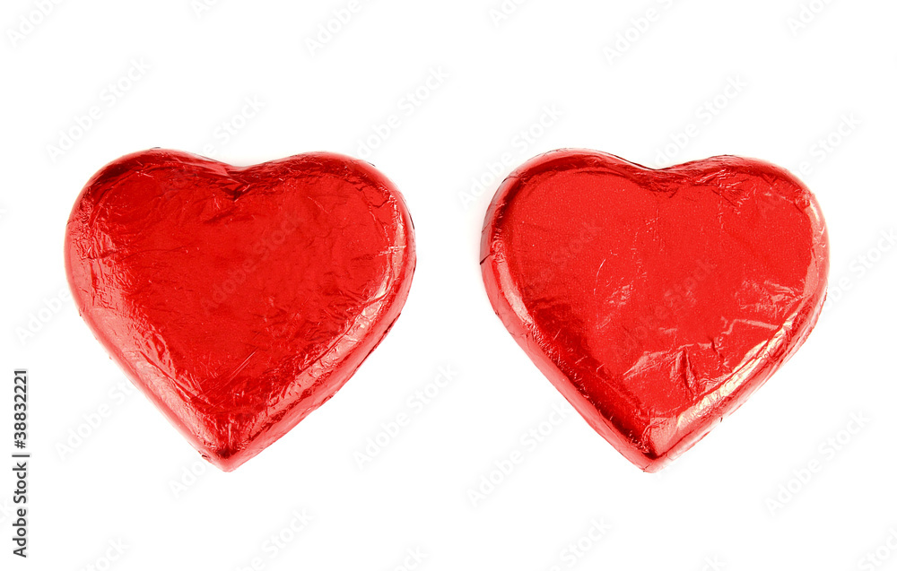 Obraz Czerwona folia zawijająca czekoladowe serca