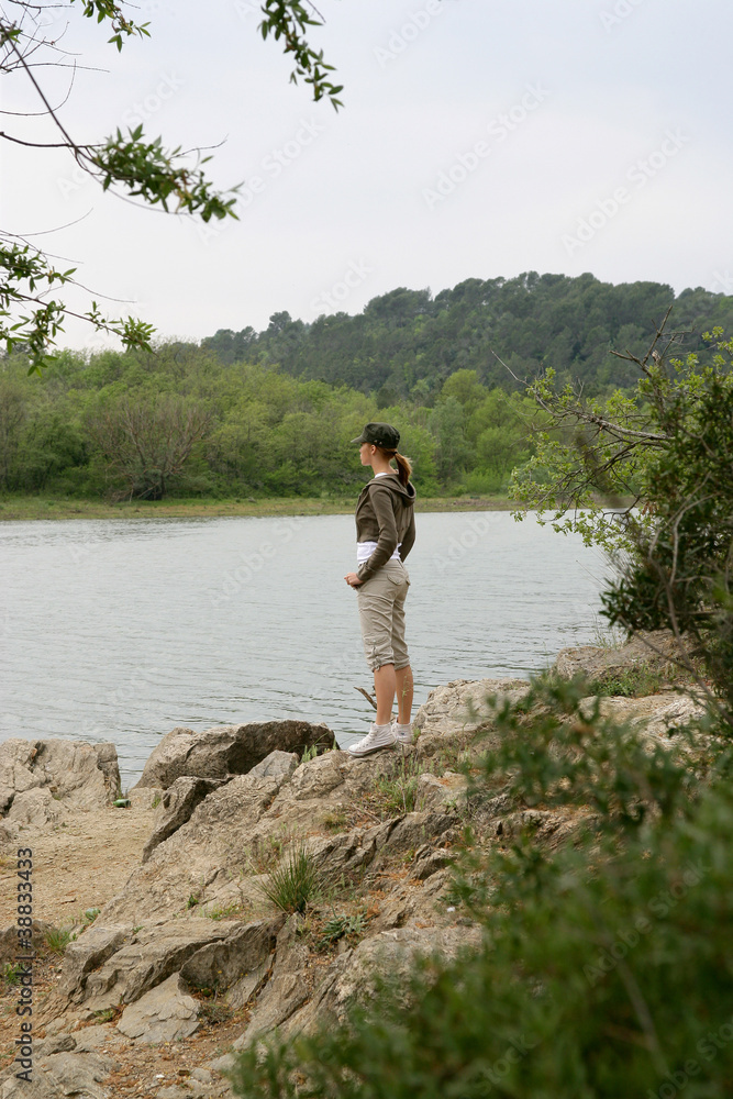 Woman on a riverbank