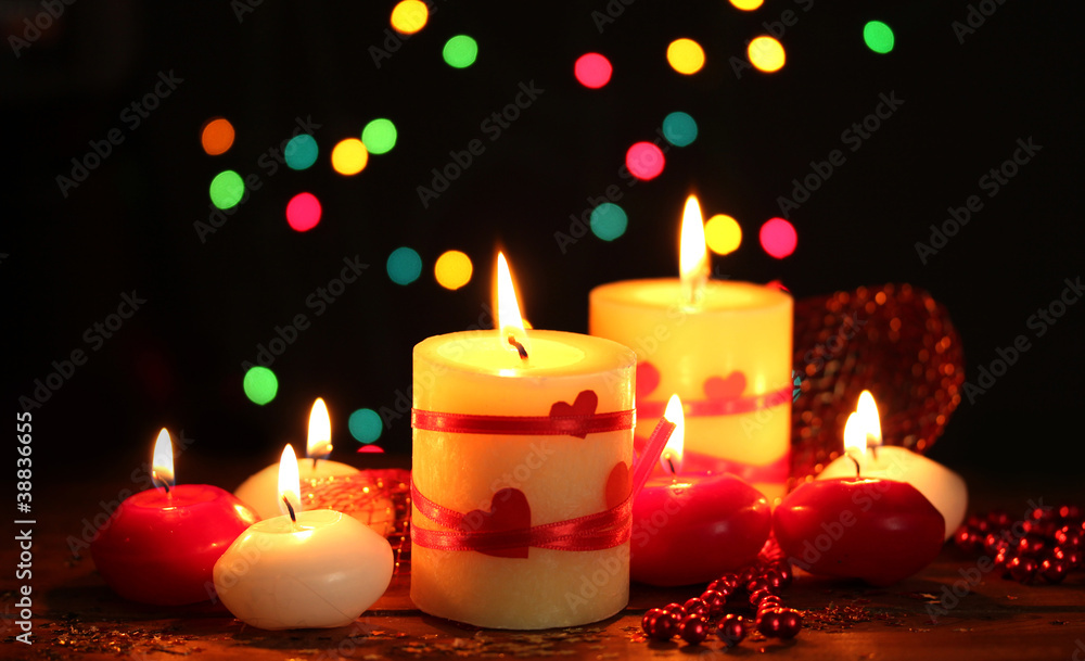 Beautiful candles on wooden table on bright background Beautiful candles on wooden table on bright background