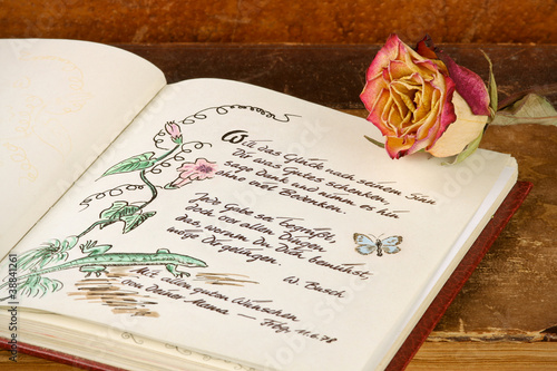 Tableau sur toile Poesiealbum mit altem Buch und Rose