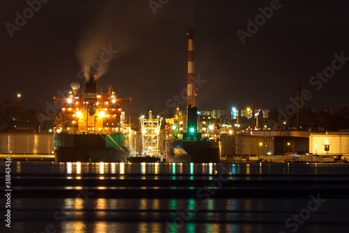 Oil tanker unloading cargo at night © kmiragaya