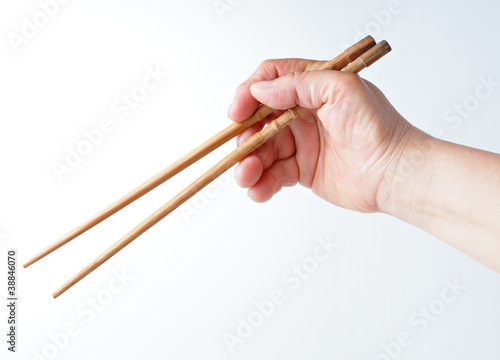 hand using chopsticks