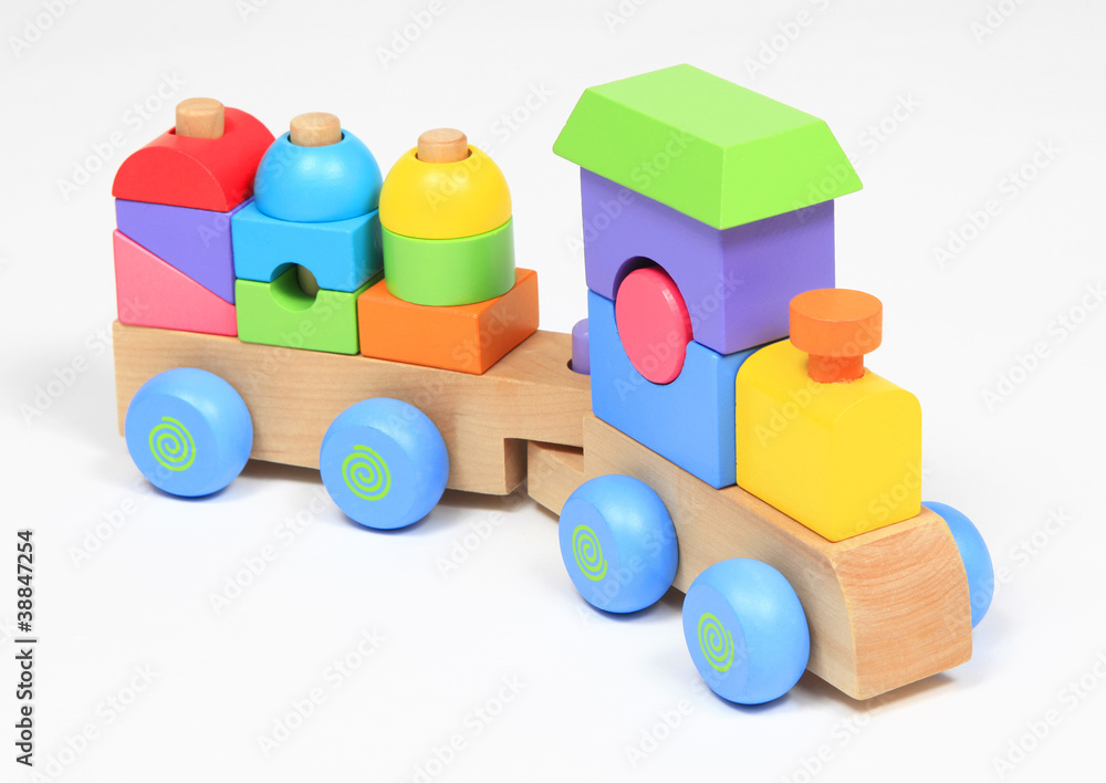 Colorful wooden train toy isolated over white Colorful wooden train toy isolated over white