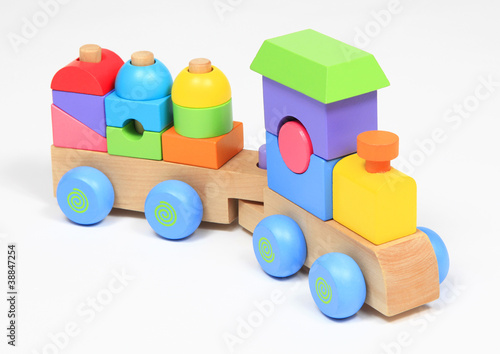 Colorful wooden train toy isolated over white