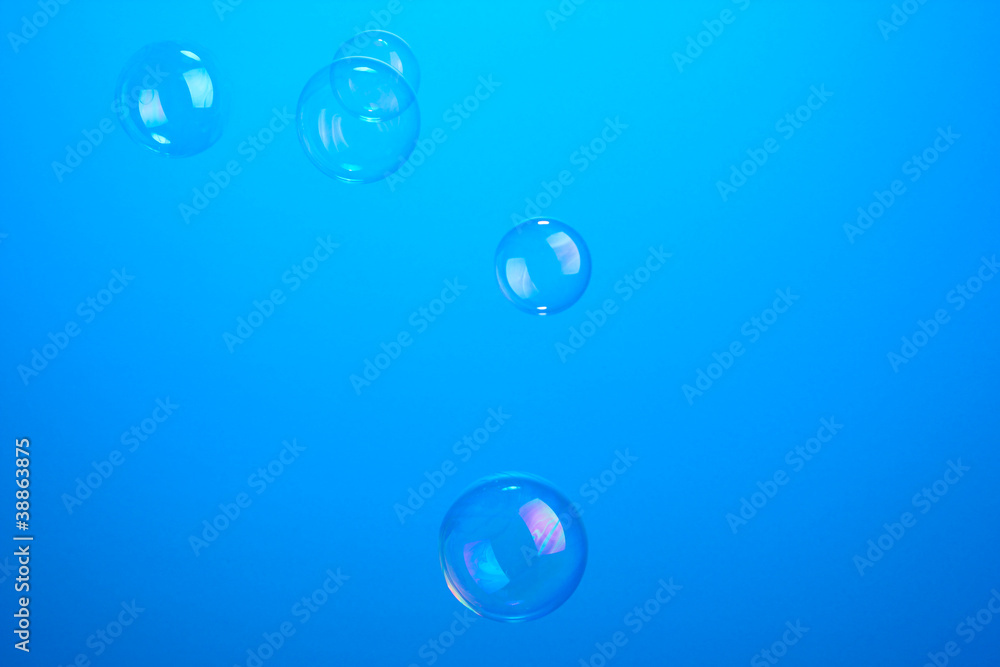 Soap bubbles on blue background Soap bubbles on blue background