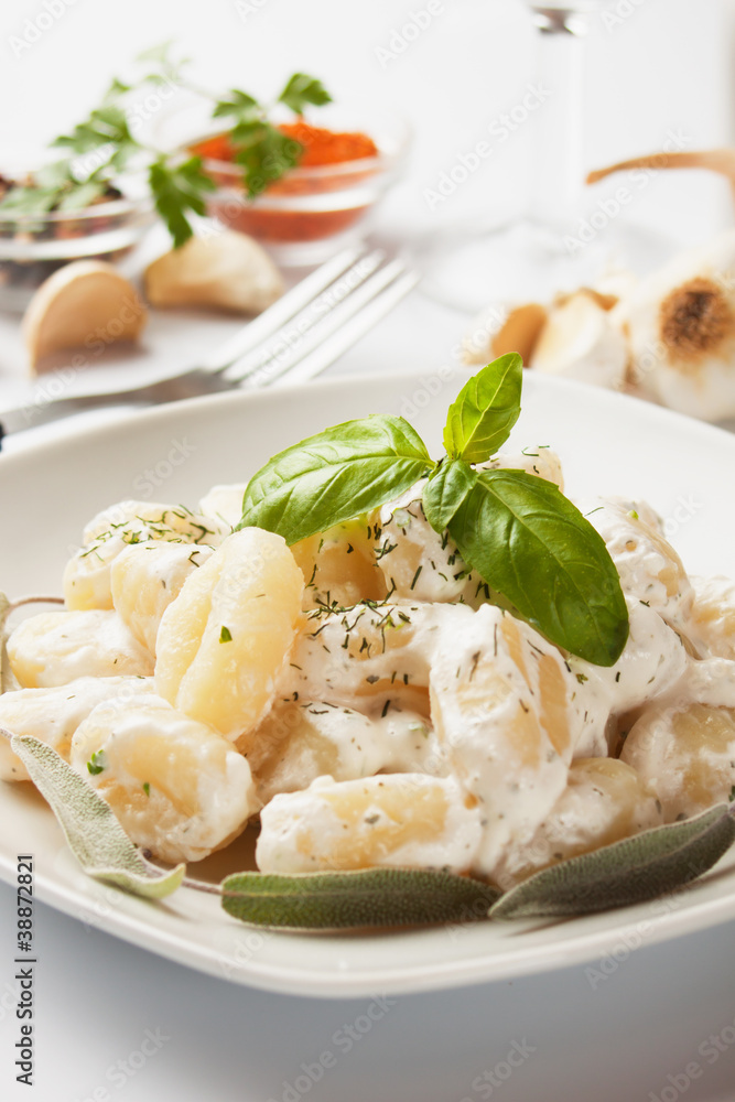 Gnocchi di patata with basilico and cheese sauce Gnocchi di patata with basilico and cheese sauce