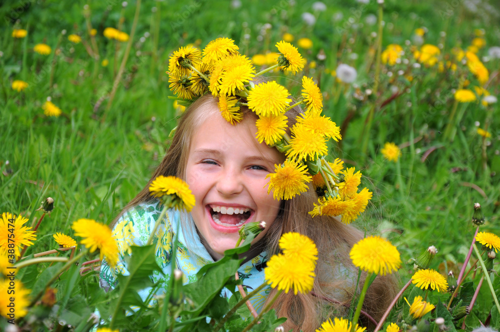 Portrait of a little girl in wreath of flowers Portrait of a little girl in wreath of flowers