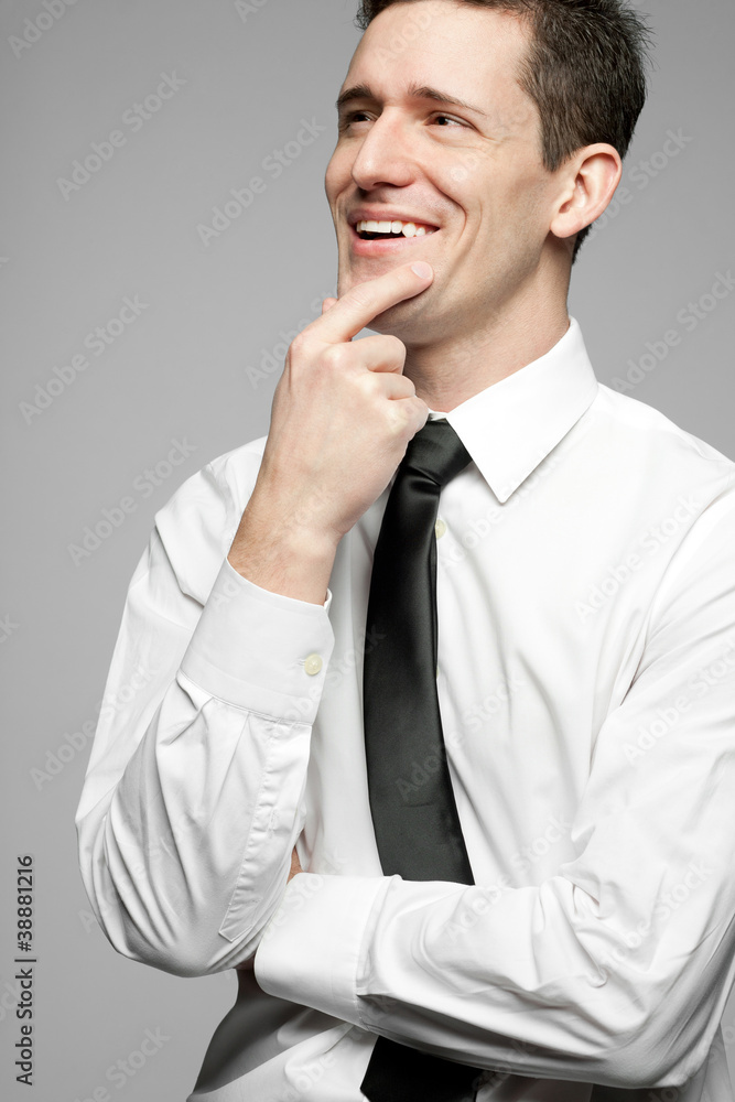 Handsome businessman in white shirt on gray background. Handsome businessman in white shirt on gray background.
