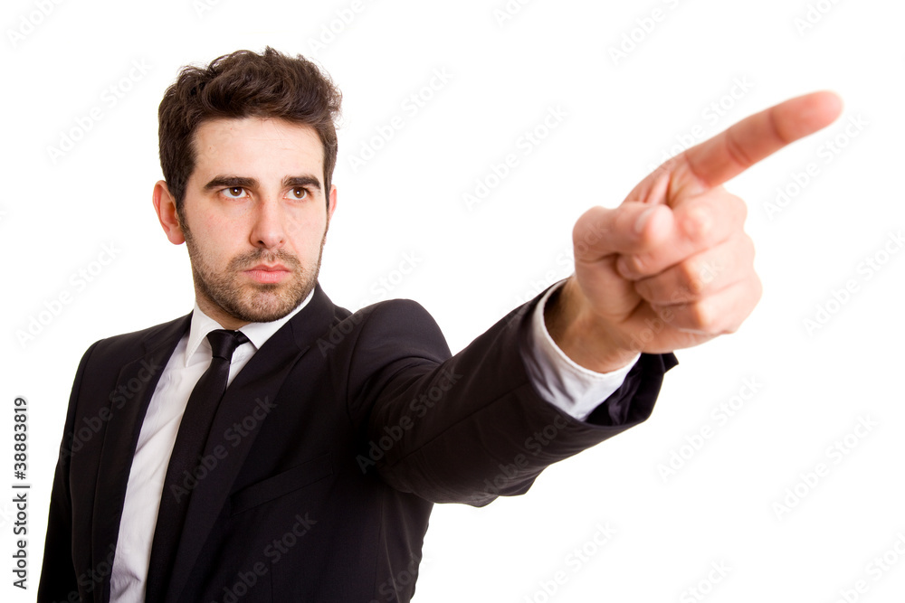 Young business man pointing at something interesting on a white Young business man pointing at something interesting on a white