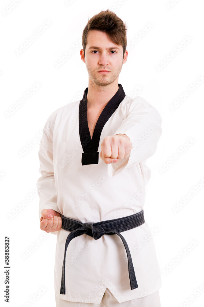 Young man practicing martial arts over white background Young man practicing martial arts over white background