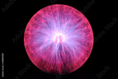 close up on purple and red glows in glass plasma lamp photo