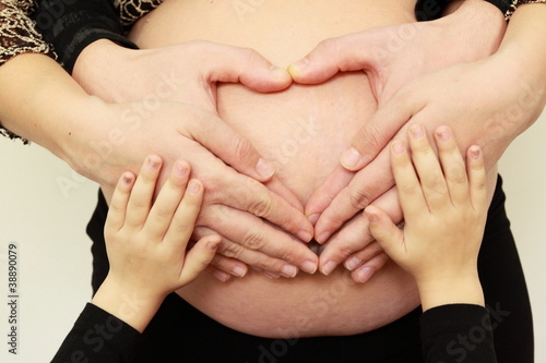 Heart from hands on pregnance bell