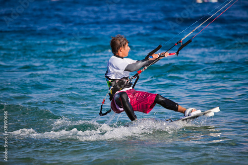 Kite surfing on the sea.