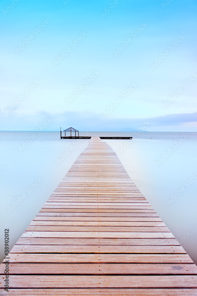 Wooden pier in a cold atmosphere. Tuscan coast.