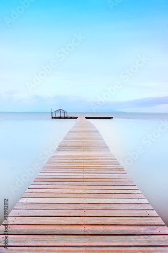 Wooden pier in a cold atmosphere. Tuscan coast.